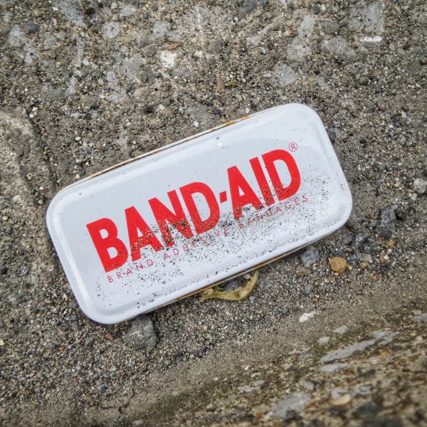 BAND-AID case outside on dirt ground